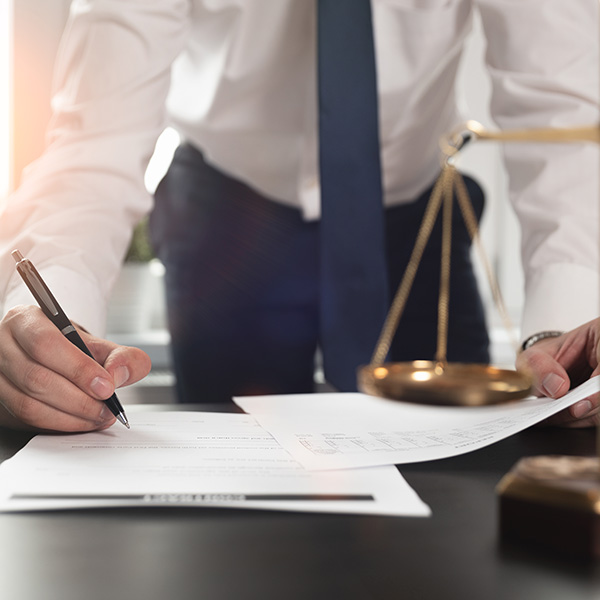 attorney signing legal documents